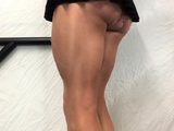 Tan thighs, cock in black mini skirt .